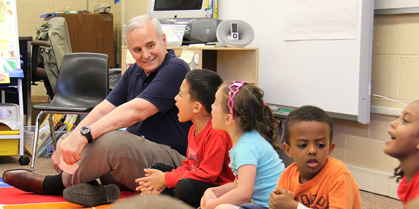 Governor Dayton visits with students in a classroom.