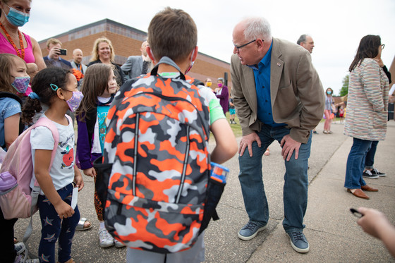 Governor Walz talks to young students at a school 