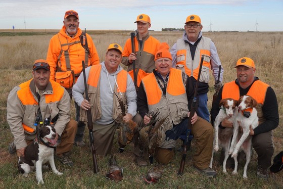 Governor Walz holds two pheasants with hunting party 