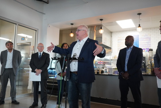 Governor Walz at coffee shop making announcement 