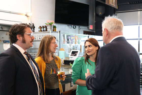 Lt. Governor Flanagan talks to two other people