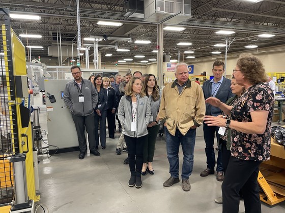 Governor Walz listens to tour in solar factory 