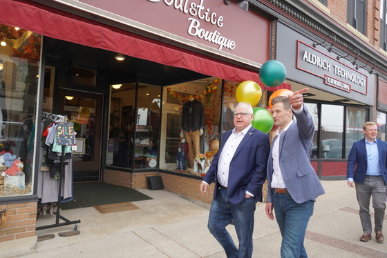 Governor Walz walks past small business 