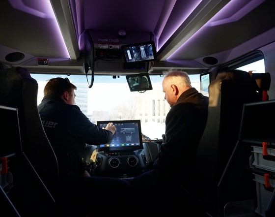 Governor Walz sits in electric fire truck