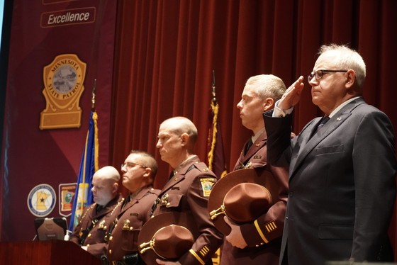 Governor Walz stands with State Troopers