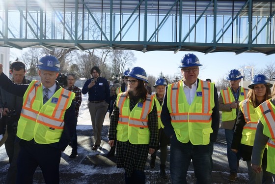 Governor Walz walks in construction vest with water workers