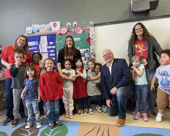 Governor Walz takes a photo with kids at school