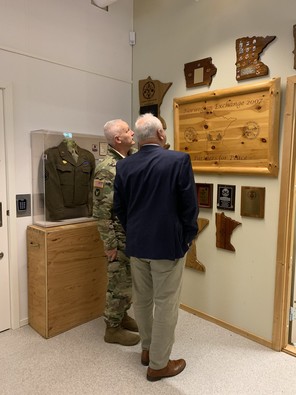 Governor Walz looks at sign in Norway 