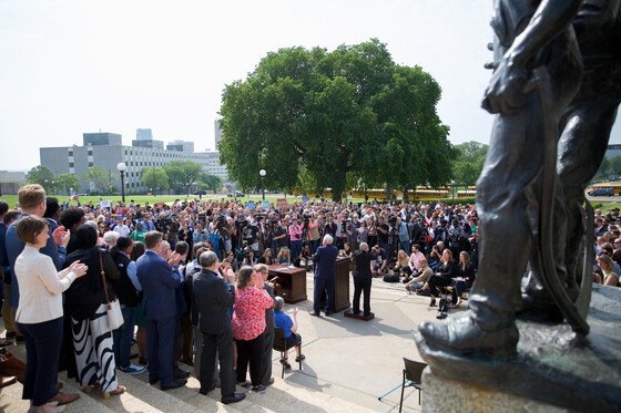 Governor Walz speaks to crowd on Capitol steps.