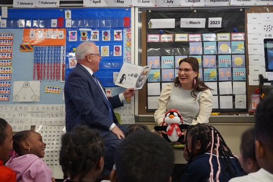 Governor Walz reading to young children at school 