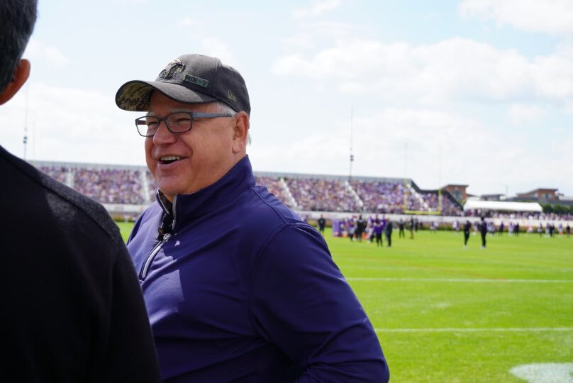 Governor Walz speaks with visitors to the Vikings Training Camp