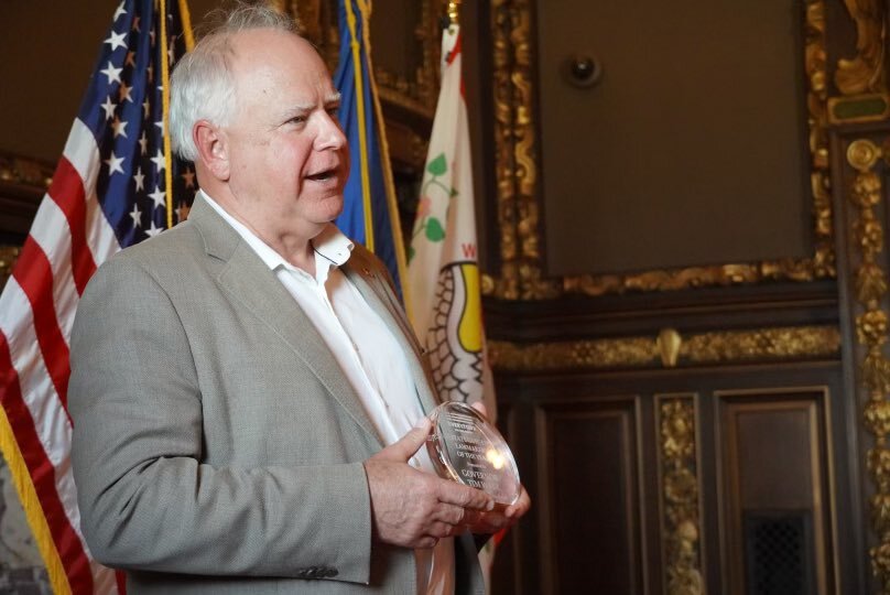 Governor Walz holds award 