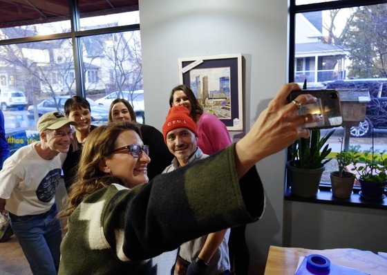 Lieutenant Governor Flanagan takes a selfie with press conference attendees.