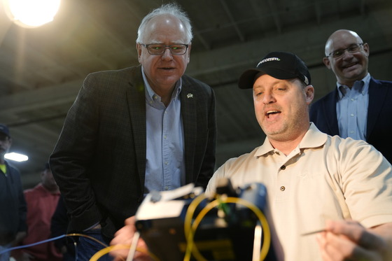 BevComm employee demonstrates splicing to Governor Walz