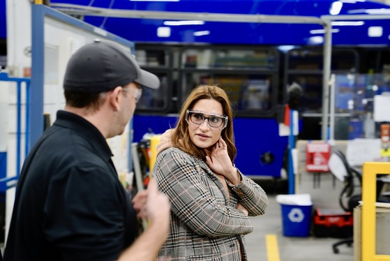 Lieutenant Governor Flanagan walks on a tour of New Flyer's bus manufacturing facility.