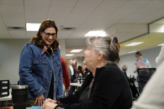 Lieutenant Governor Flanagan greets a Minnesotan at a tax preparation site in St. Paul