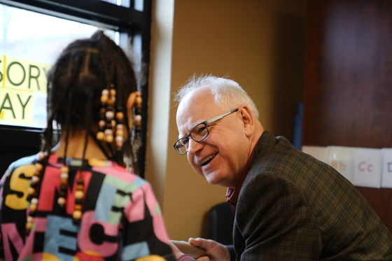 Governor Walz talks to young child 