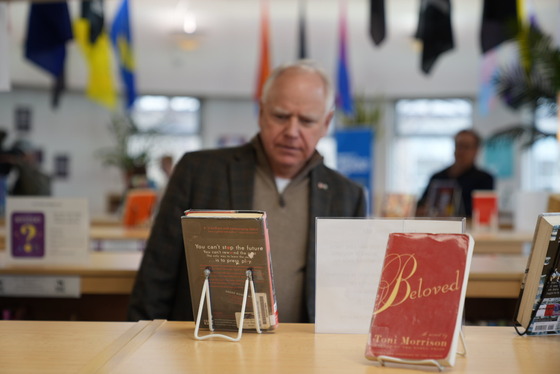 Governor Walz views a display of banned books at a school library in Saint Paul