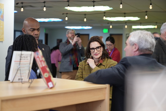 Lieutenant Governor Flanagan speaks with legislators at a school library in Saint Paul