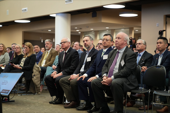 Governor Walz watches speakers at the Upsher-Smith/Bora celebration