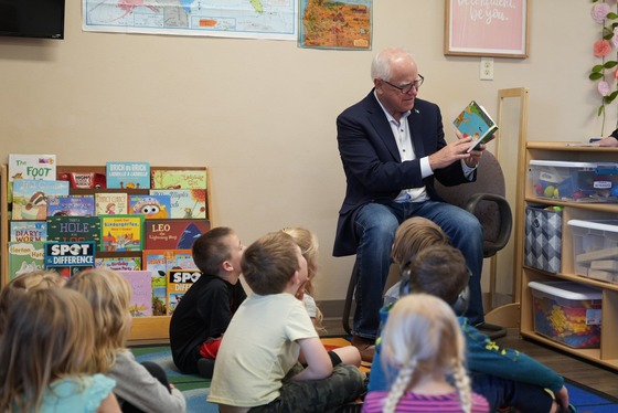 Governor Walz reads a book to kids in a child care classroom 