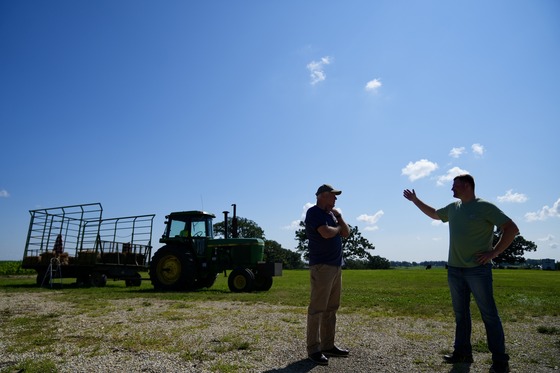 Governor Walz speaks with Matt Kruger on his farm in Pine Island