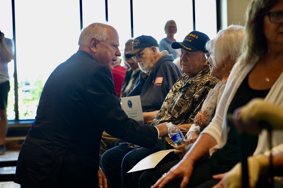 Governor Walz speaks with a veteran and his wife at the newly-opened Montevideo Veterans Home