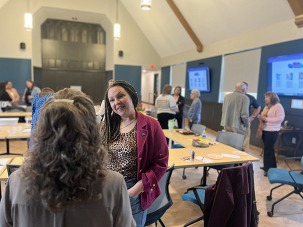 Photo of CEO and community members at Listening Tour