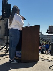 Ashley Oolman at a podium at the state Capitol