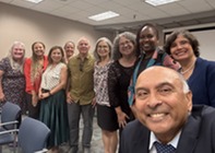 A group of Rochester leaders pose for a photo with Chief Equity Officer