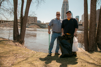 Couple cleaning up along Mississippi River