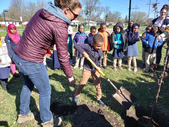 Planting trees at Prairie Seeds Academy
