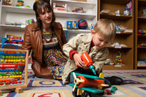 Boy and mom playing with toys