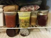 Containers of food in freezer