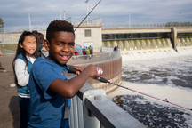 Students fishing at Coon Rapids Dam