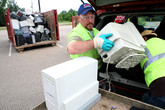 Electronics being unloaded at hazardous waste collection event