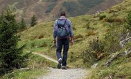 Photo of a person hiking outside with a backpack on