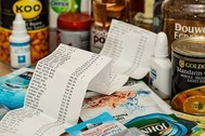 Photo of canned food with a cash register receipt