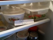 Eat first shelf labeled in fridge