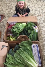 Young girl with CSA box