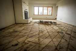 Living room with flooring that has been removed