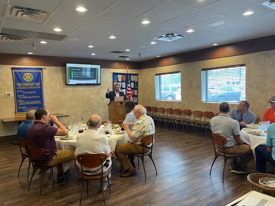 Chris speaks at the Hopkins rotary weekly meeting