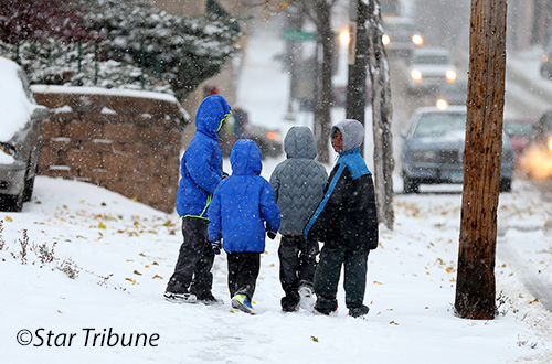 Kids walking in a snowstorm, photo from the Star Tribune