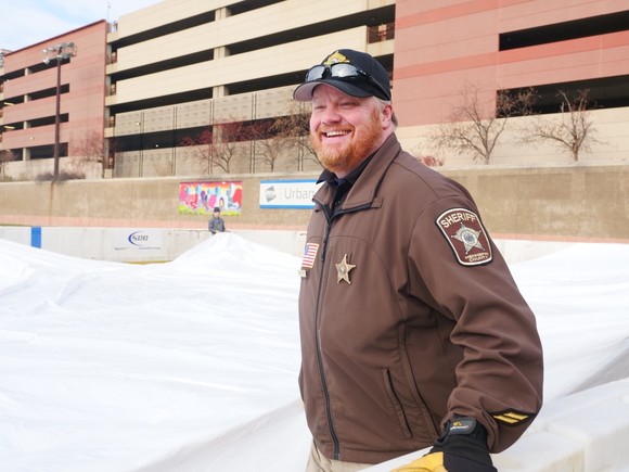 Deputy Svenby Helping Setup a Rink