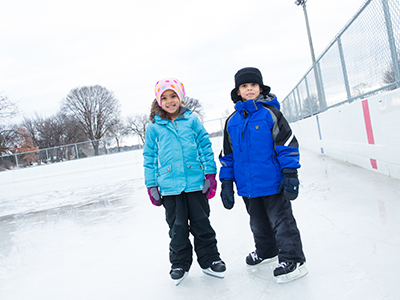 Two kids ice skating