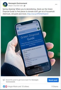 Person holding iPhone with the online Green Disposal Guide on screen