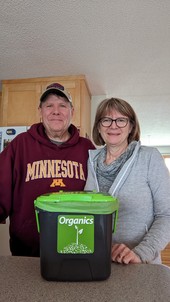Couple with organics recycling countertop container
