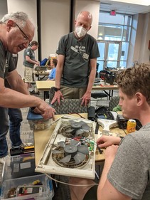 Fix-It Clinic volunteers helping repair a fan