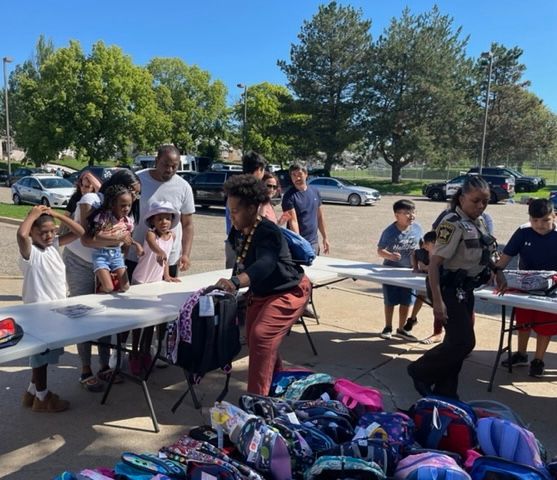 Barbers and backpacks event last month