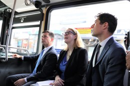 Secretary Pete Buttigieg, Commissioner Marion Greene, and Mayor Jacob Frey riding a bus